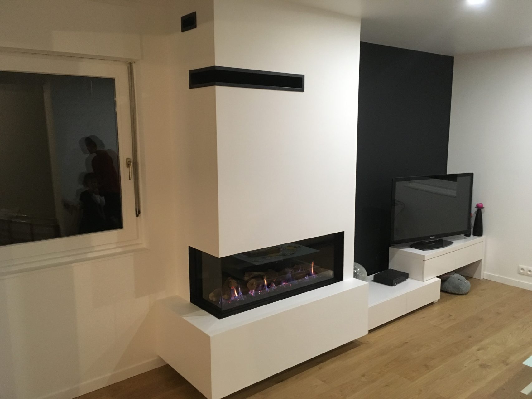 Installation réalisé par notre vendeur SEGUIN à melun d'un insert à bois avec un coffrage